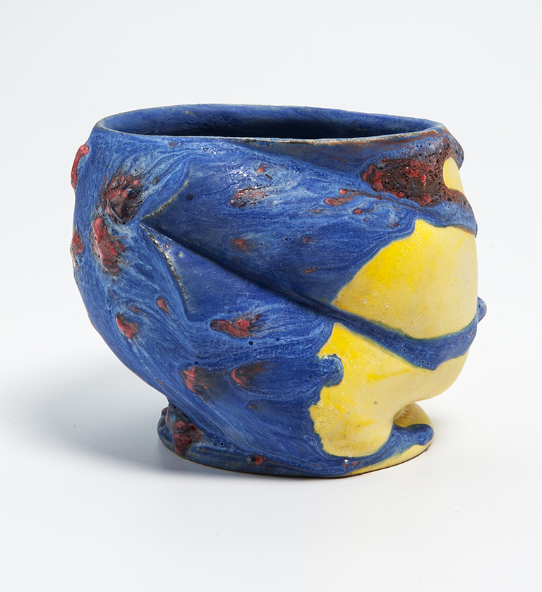 A blue and yellow ceramic piece.