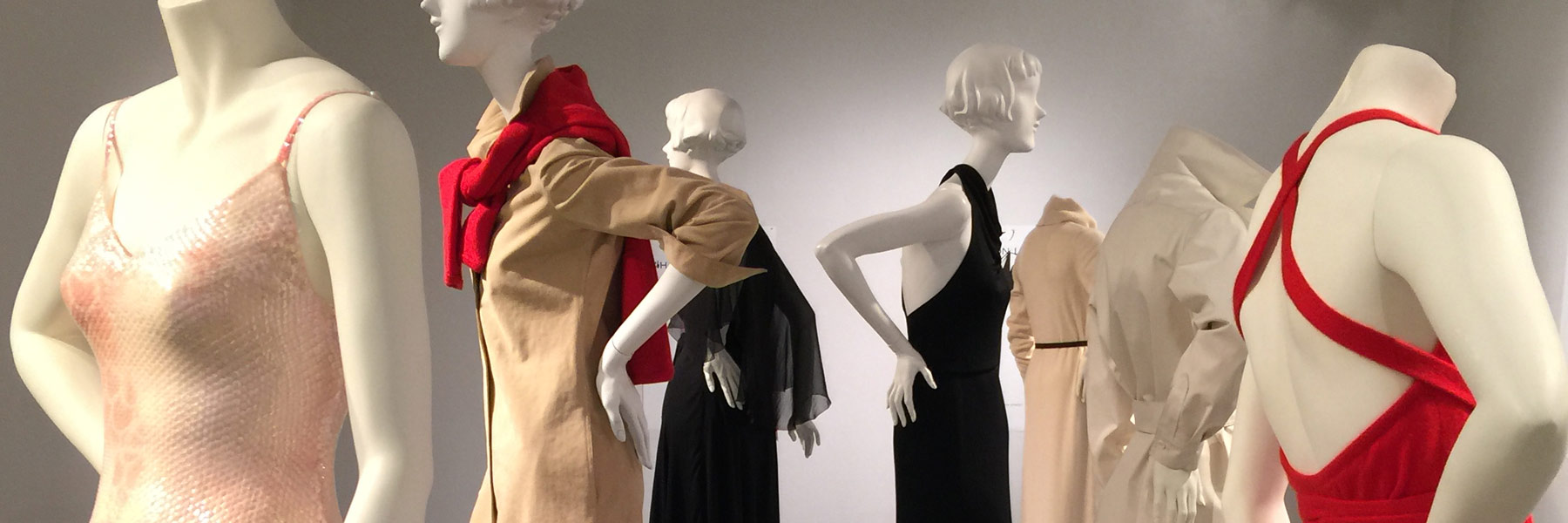 Mannequins wearing outfits.