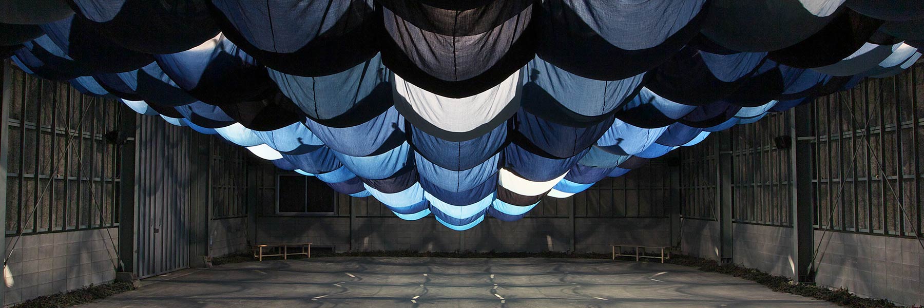 Ballooning blue fabric on ceiling
