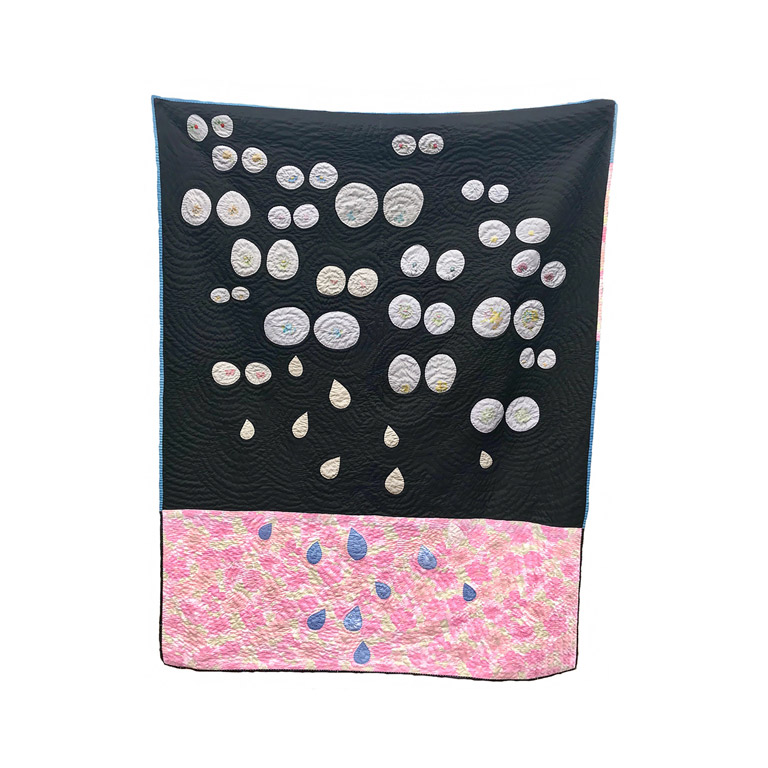 A black, white, and pink quilt.