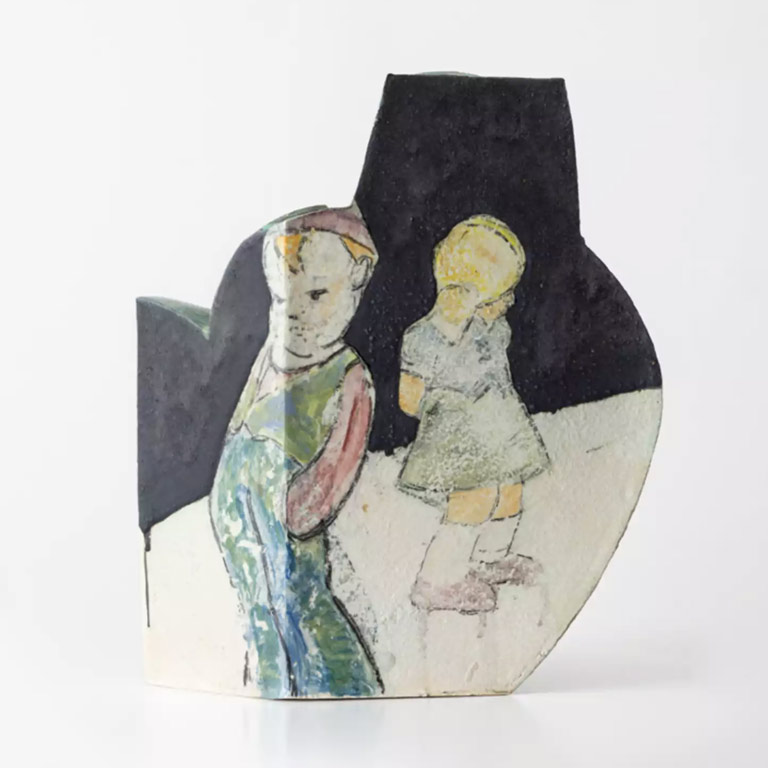 A black and white ceramic vessel with two human figures painted on top. 