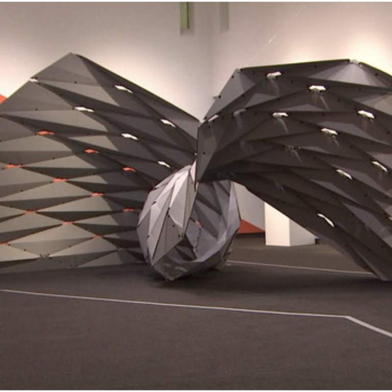 Spider-like sculpture of folded elements.